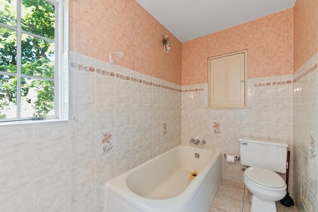 1046 N 7th St, Rochelle, IL 61068 - full bath featuring tile walls, a bath, plenty of natural light, and tile patterned floors