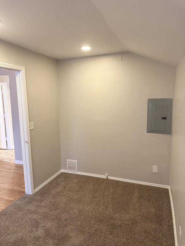 5125 W 101st St, Oak Lawn, IL 60453 - empty room featuring electric panel, carpet floors, lofted ceiling, and recessed lighting