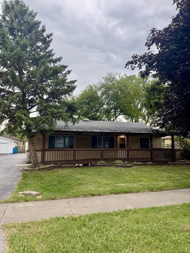5125 W 101st St, Oak Lawn, IL 60453 - ranch-style house with a front lawn, a garage, and a porch