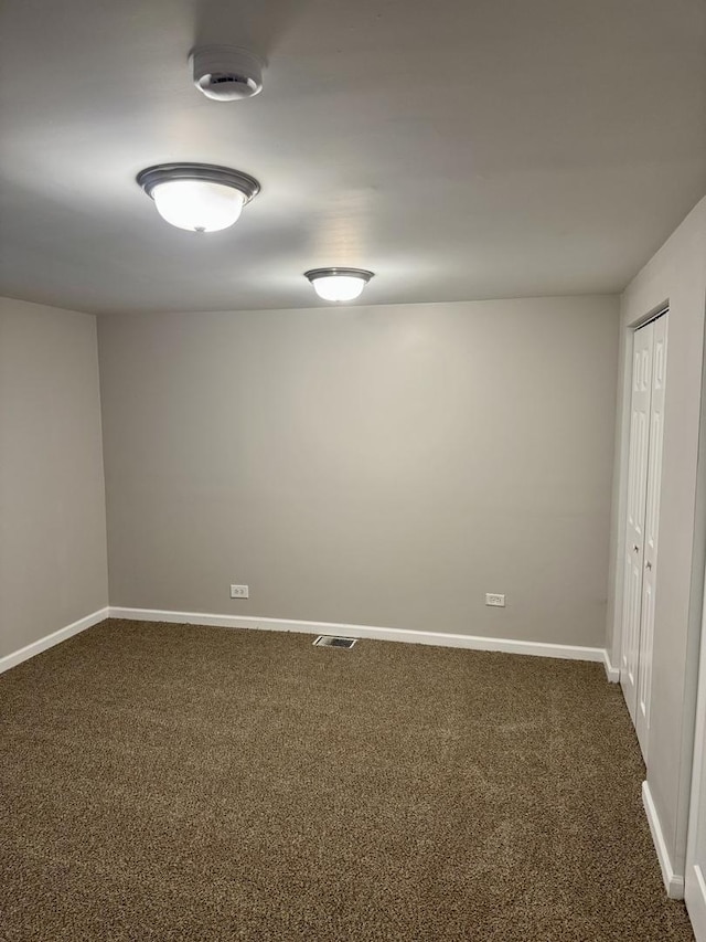 5125 W 101st St, Oak Lawn, IL 60453 - spare room featuring dark carpet and a smoke detector