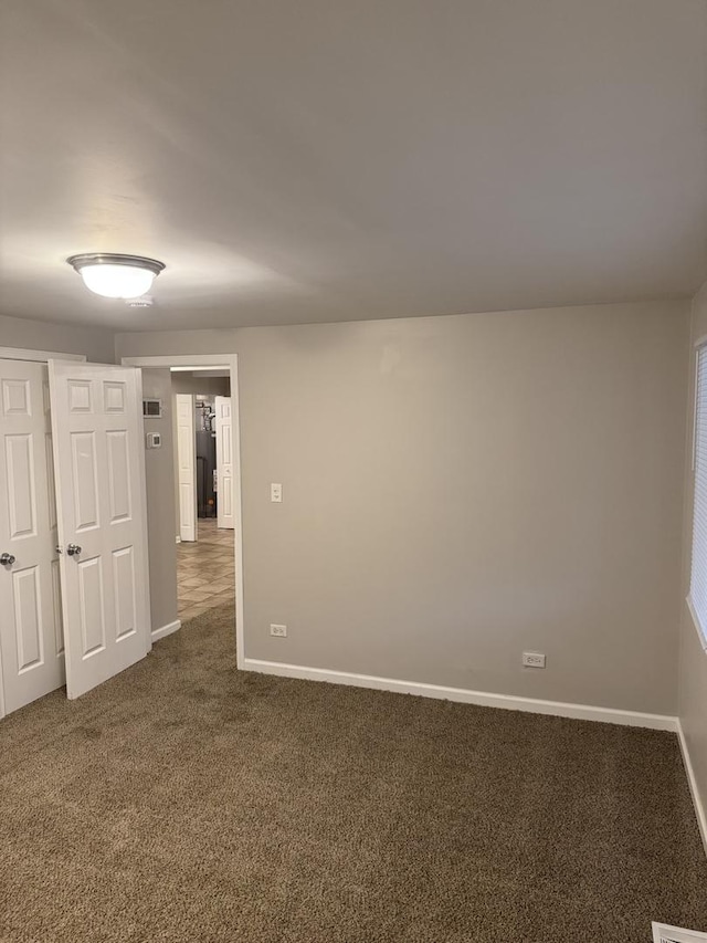 5125 W 101st St, Oak Lawn, IL 60453 - unfurnished room with dark carpet and baseboards