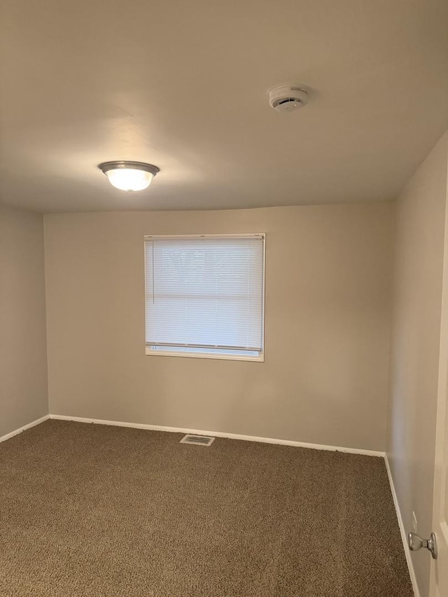 5125 W 101st St, Oak Lawn, IL 60453 - empty room with carpet floors and a smoke detector