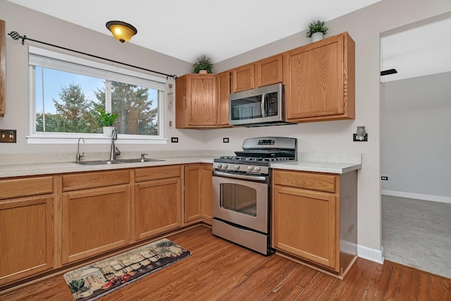 26226 W Tallgrass Trl, Channahon, IL 60410 - kitchen with appliances with stainless steel finishes, light countertops, and light wood-style flooring