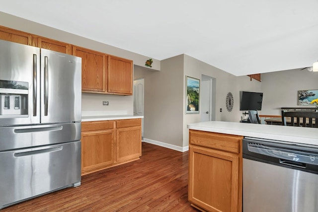 26226 W Tallgrass Trl, Channahon, IL 60410 - kitchen with stainless steel appliances, wood finished floors, light countertops, and brown cabinetry