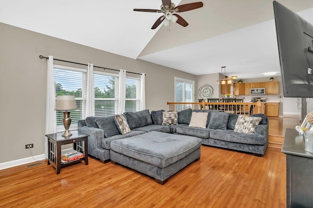 26226 W Tallgrass Trl, Channahon, IL 60410 - living room featuring light wood-style floors, ceiling fan, and vaulted ceiling
