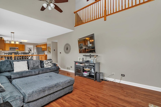 26226 W Tallgrass Trl, Channahon, IL 60410 - living room featuring a ceiling fan, wood finished floors, and a towering ceiling
