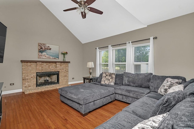 26226 W Tallgrass Trl, Channahon, IL 60410 - living room featuring high vaulted ceiling, wood finished floors, a ceiling fan, and a brick fireplace