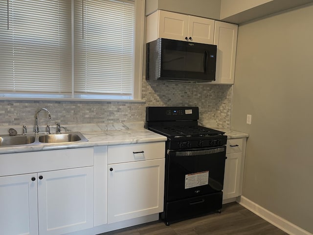 6959 S Racine Ave, Chicago, IL 60636 - kitchen with black appliances, backsplash, dark wood-style floors, and white cabinetry