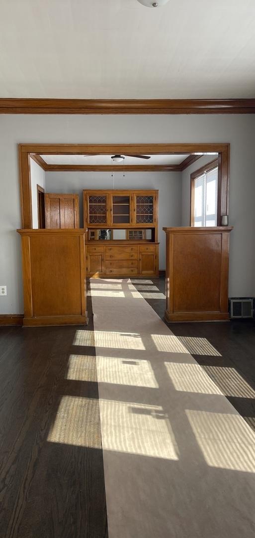 6959 S Racine Ave, Chicago, IL 60636 - corridor with ornamental molding and dark wood-style floors