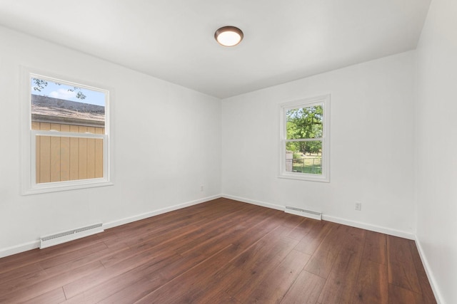 1063 S 8th Ave, Kankakee, IL 60901 - empty room with dark wood-style floors and baseboards