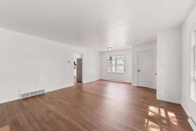 1063 S 8th Ave, Kankakee, IL 60901 - spare room with wood finished floors and baseboard heating