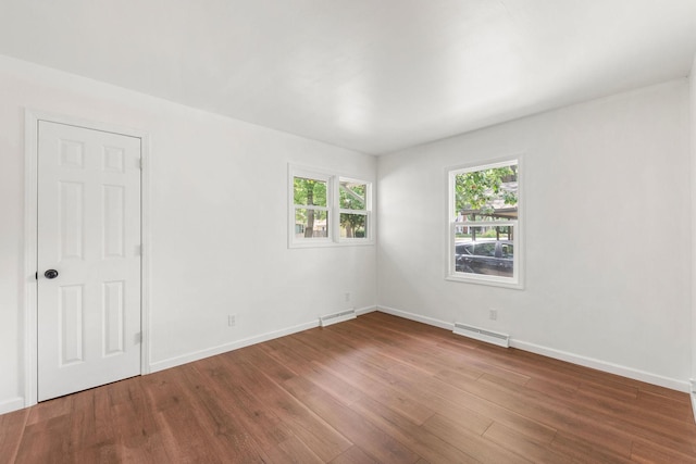 1063 S 8th Ave, Kankakee, IL 60901 - empty room featuring wood finished floors and baseboards