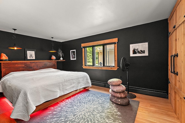 1108 Plaza Dr, New Lenox, IL 60451 - bedroom featuring light wood-style floors and a baseboard heating unit