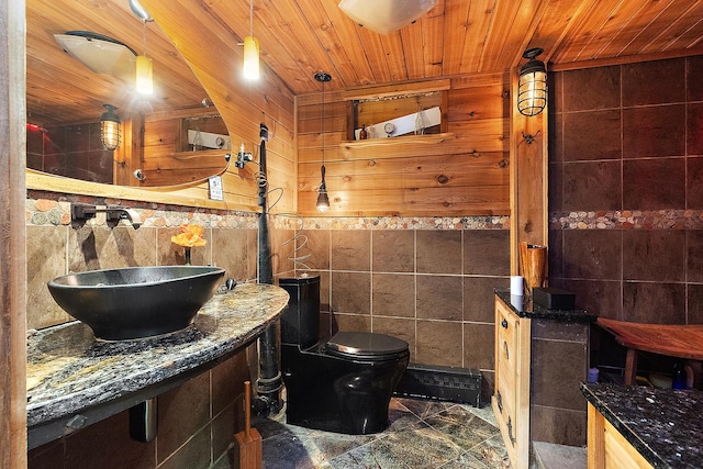 1108 Plaza Dr, New Lenox, IL 60451 - bathroom with tile walls, wood ceiling, and a wainscoted wall