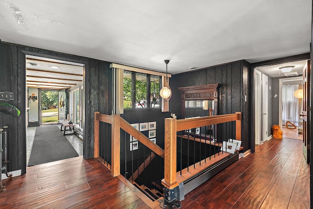 1108 Plaza Dr, New Lenox, IL 60451 - hall featuring an upstairs landing, wood-type flooring, and wood walls