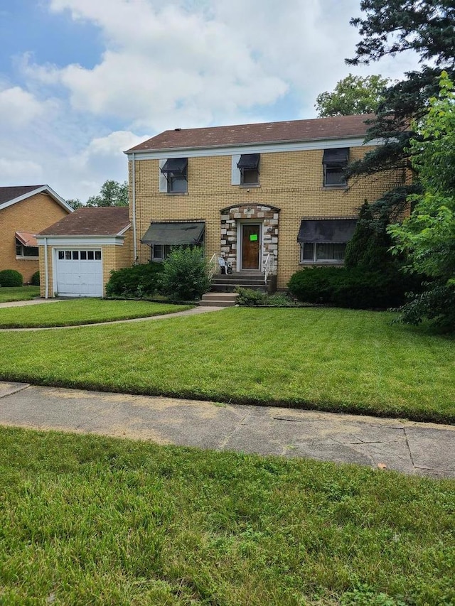 view of front of property with a front lawn and an attached garage
