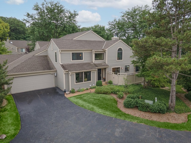 285 N Bay Ct, Lake Barrington, IL 60010 - view of front of home featuring roof with shingles, a garage, driveway, and a chimney
