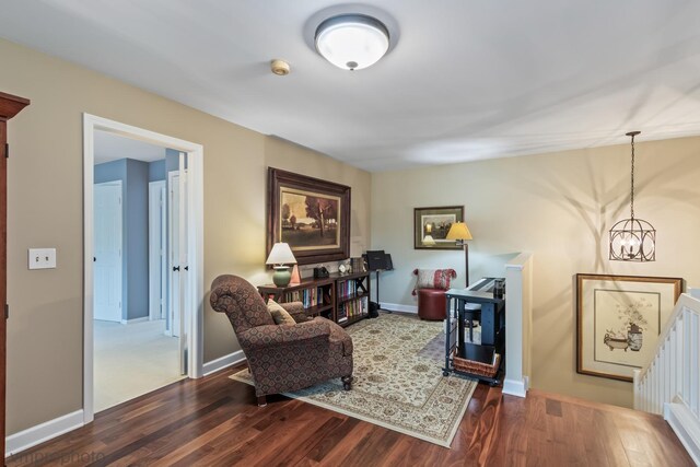 285 N Bay Ct, Lake Barrington, IL 60010 - living area with dark wood-style floors, an upstairs landing, and a chandelier