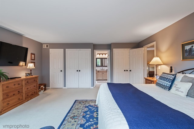 285 N Bay Ct, Lake Barrington, IL 60010 - bedroom featuring multiple closets, carpet flooring, and ensuite bath