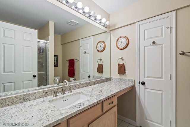 285 N Bay Ct, Lake Barrington, IL 60010 - bathroom featuring vanity, a shower with shower door, and tile patterned flooring