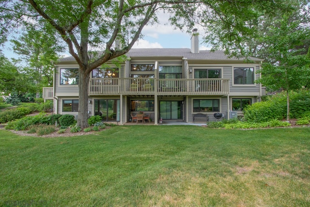 285 N Bay Ct, Lake Barrington, IL 60010 - back of house with a chimney, a lawn, and a patio area
