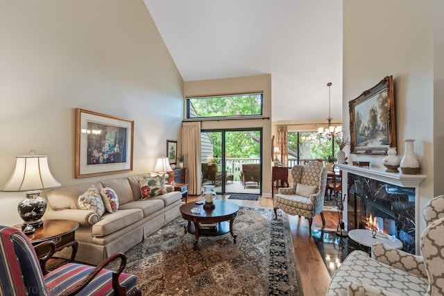 285 N Bay Ct, Lake Barrington, IL 60010 - living room with high vaulted ceiling, wood finished floors, a chandelier, and a fireplace