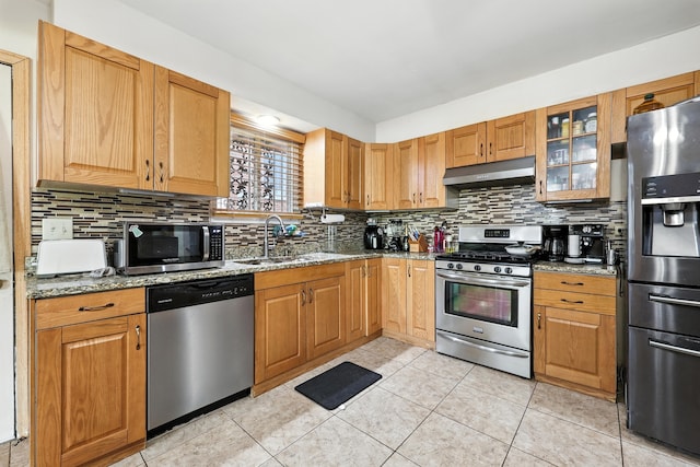 5721 W 88th Pl, Oak Lawn, IL 60453 - kitchen featuring appliances with stainless steel finishes, under cabinet range hood, light stone countertops, and tasteful backsplash