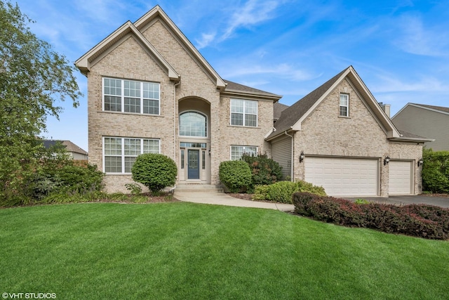 1755 Goldsboro Ln, Crystal Lake, IL 60014 - traditional-style home featuring brick siding, a front lawn, driveway, and an attached garage