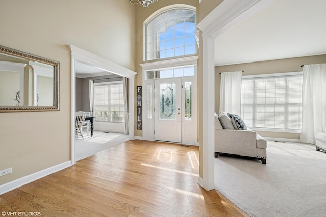 1755 Goldsboro Ln, Crystal Lake, IL 60014 - entryway featuring wood finished floors, a chandelier, and a high ceiling