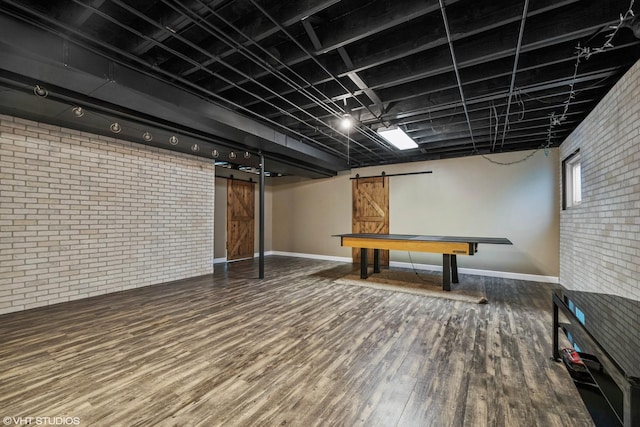 1755 Goldsboro Ln, Crystal Lake, IL 60014 - finished below grade area with brick wall, a barn door, and wood finished floors