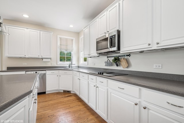 1755 Goldsboro Ln, Crystal Lake, IL 60014 - kitchen featuring appliances with stainless steel finishes, dark countertops, white cabinetry, and recessed lighting
