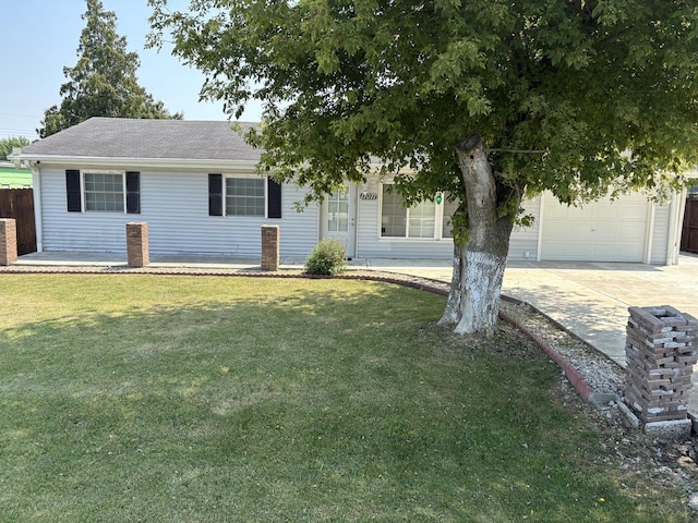 11071 E Fisher Rd, Rochelle, IL 60168 - view of front facade with concrete driveway, a front yard, an attached garage, and a shingled roof