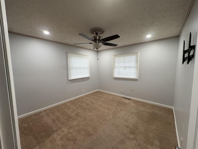 11071 E Fisher Rd, Rochelle, IL 60168 - spare room featuring ceiling fan, carpet floors, a textured ceiling, and recessed lighting