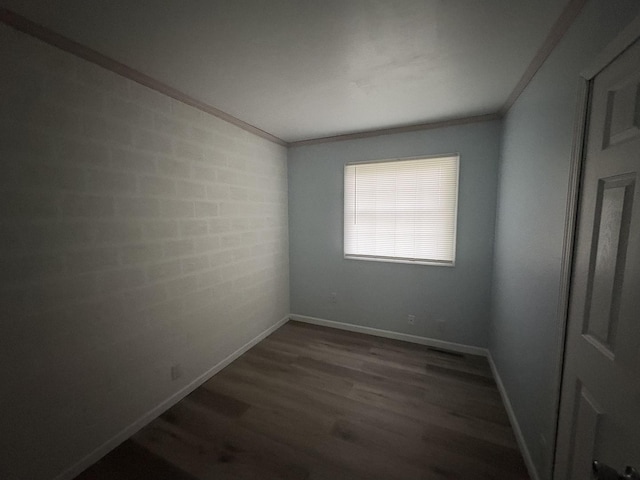 11071 E Fisher Rd, Rochelle, IL 60168 - empty room with ornamental molding and dark wood finished floors