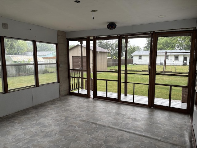 11071 E Fisher Rd, Rochelle, IL 60168 - unfurnished sunroom with stone flooring