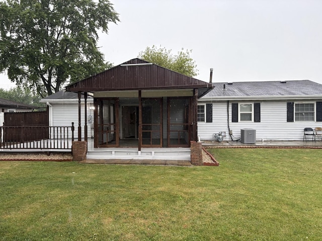 11071 E Fisher Rd, Rochelle, IL 60168 - rear view of house featuring a sunroom and a shingled roof