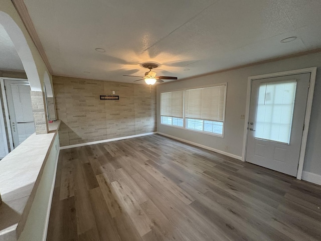 11071 E Fisher Rd, Rochelle, IL 60168 - foyer featuring a ceiling fan, wood finished floors, a textured ceiling, and arched walkways