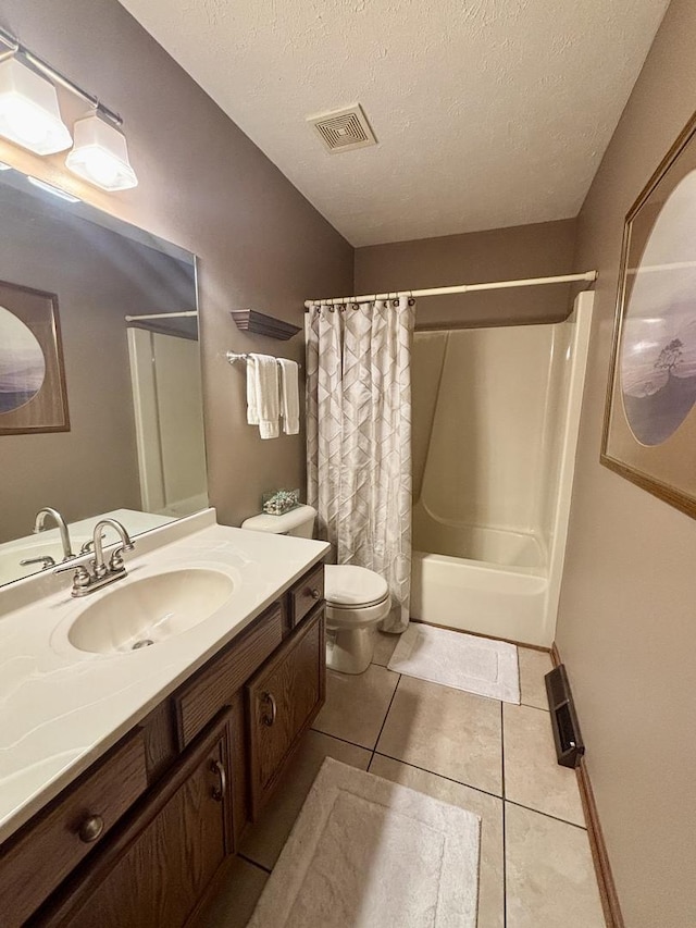 120 Colebrook Pl, Rockton, IL 61072 - bathroom with vanity, tile patterned flooring, shower / tub combo, and a textured ceiling