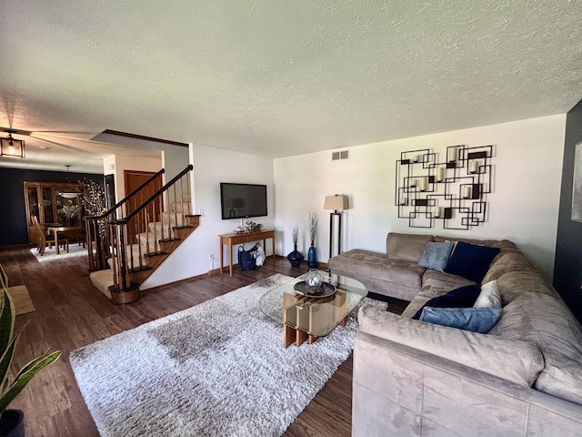 120 Colebrook Pl, Rockton, IL 61072 - living room featuring a textured ceiling, wood finished floors, stairs, and a chandelier