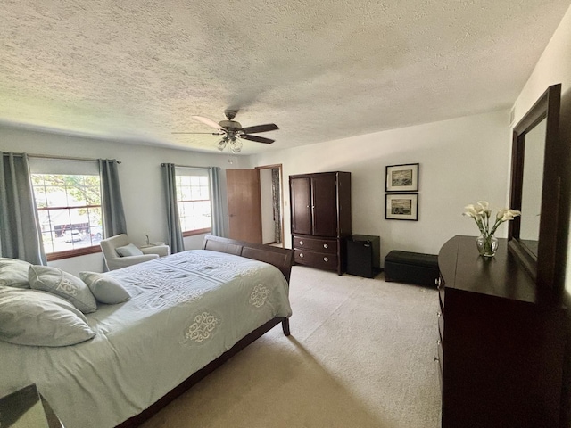 120 Colebrook Pl, Rockton, IL 61072 - bedroom with light carpet, a textured ceiling, and a ceiling fan