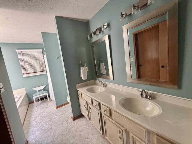 120 Colebrook Pl, Rockton, IL 61072 - bathroom featuring double vanity, a garden tub, and a textured ceiling