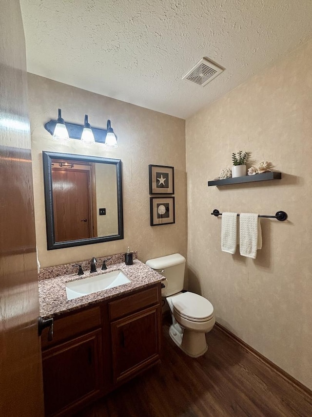 120 Colebrook Pl, Rockton, IL 61072 - bathroom with wood finished floors, vanity, and a textured ceiling