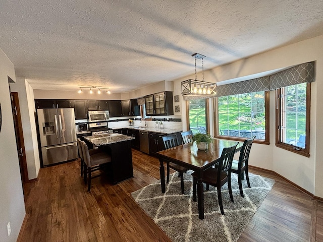 120 Colebrook Pl, Rockton, IL 61072 - dining space with dark wood-style floors and a textured ceiling