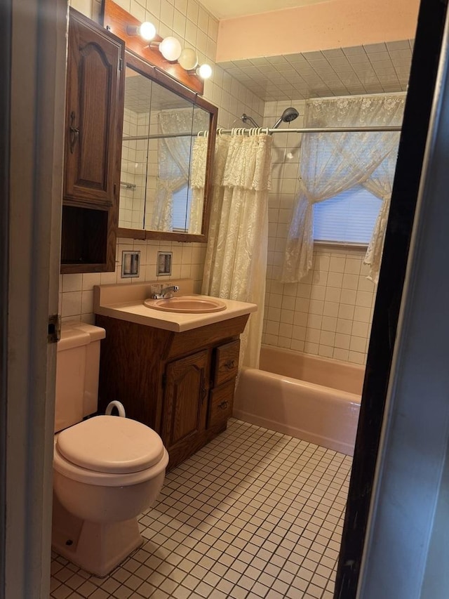 6006 Pershing Ave, Downers Grove, IL 60516 - full bathroom with tile patterned flooring, shower / bath combo, vanity, and tile walls