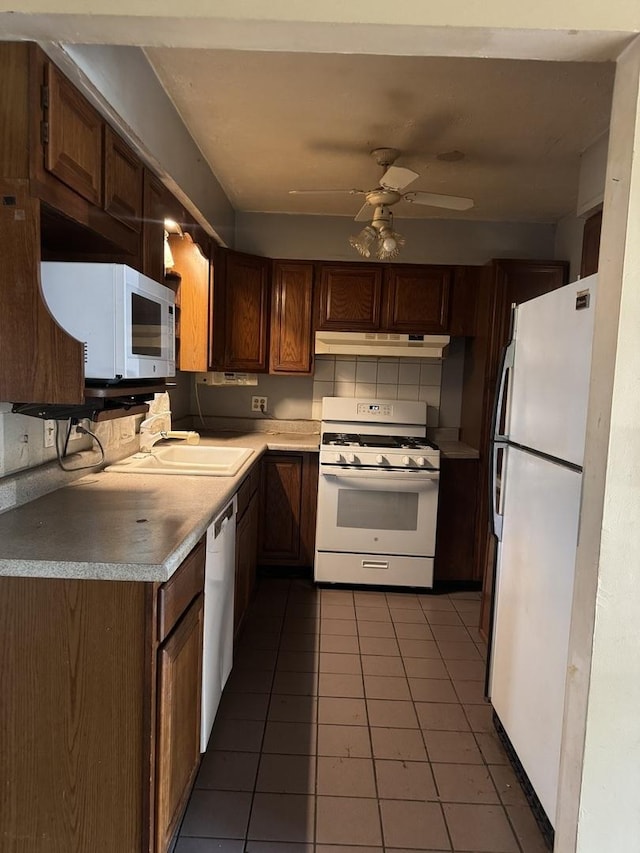 6006 Pershing Ave, Downers Grove, IL 60516 - kitchen with white appliances, under cabinet range hood, tile patterned floors, ceiling fan, and light countertops