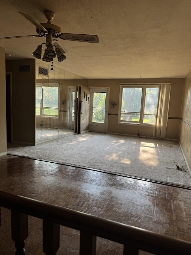 6006 Pershing Ave, Downers Grove, IL 60516 - unfurnished living room with ceiling fan and baseboards