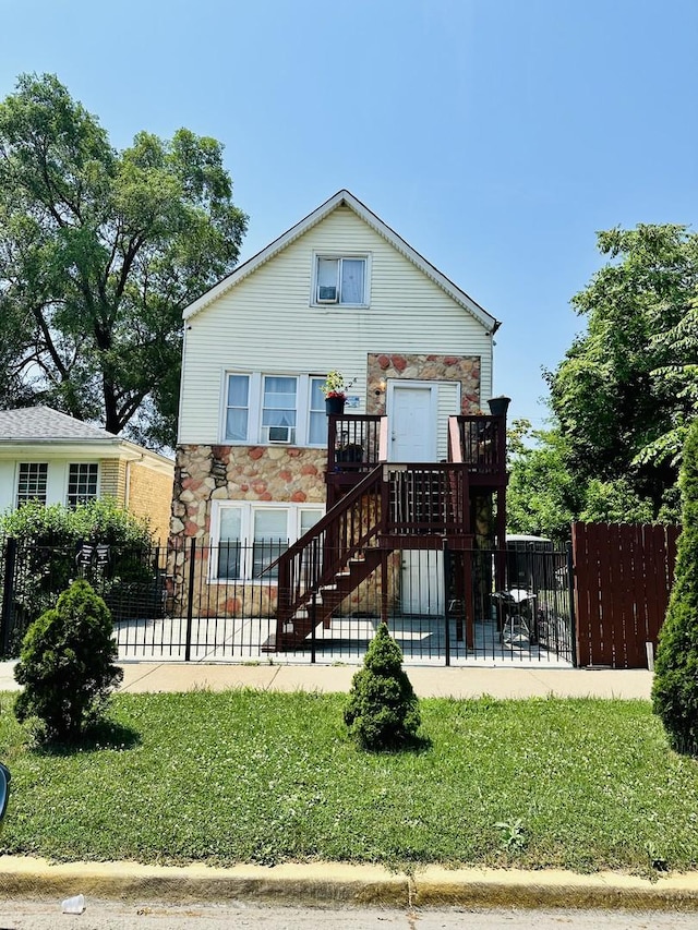 5424 S Winchester Ave, Chicago, IL 60609 - view of front of home featuring stone siding, a patio, and stairway
