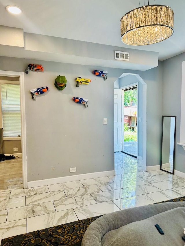 5424 S Winchester Ave, Chicago, IL 60609 - interior space featuring light marble finish flooring, arched walkways, and recessed lighting