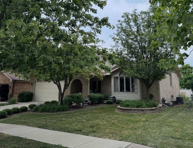 17081 Bonnie Trl W, Oak Forest, IL 60452 - obstructed view of property with a front yard, a garage, concrete driveway, and brick siding