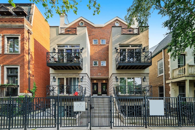 2031 W Saint Paul Ave Unit 2W, Chicago, IL 60647 - townhome / multi-family property with brick siding and a balcony
